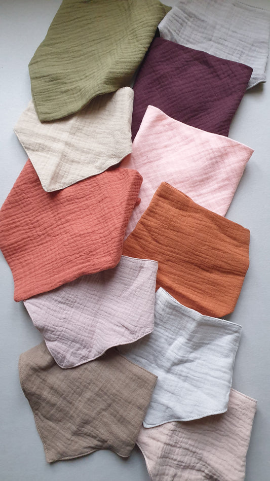 A collection of crumpled fabric swatches in various colors.