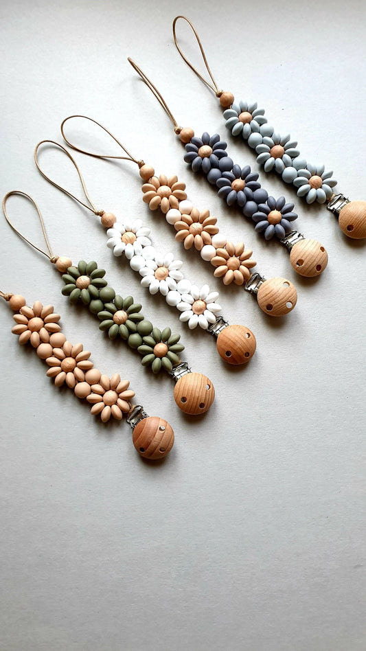 Six handmade keychains with floral beads in assorted colors.